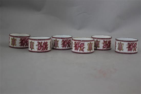 A set of six late 19th century enamel on copper circular napkin rings, 2in.
